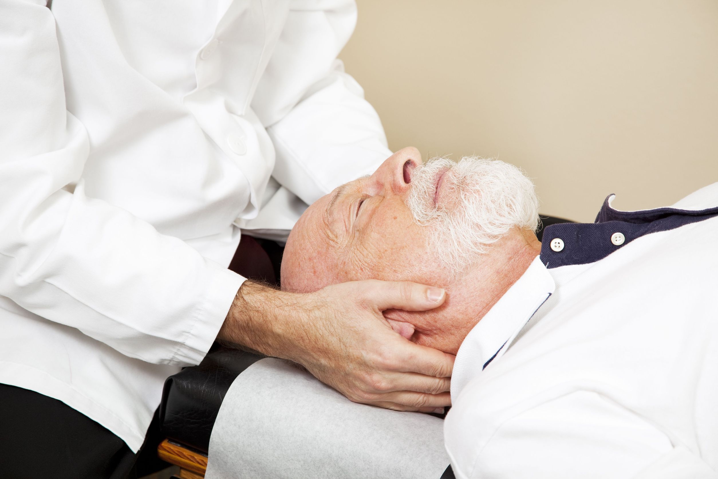 Chiropractor on old man