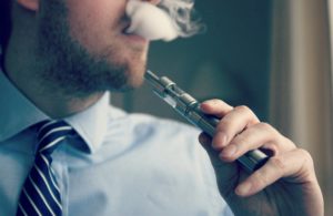 man vaping in room
