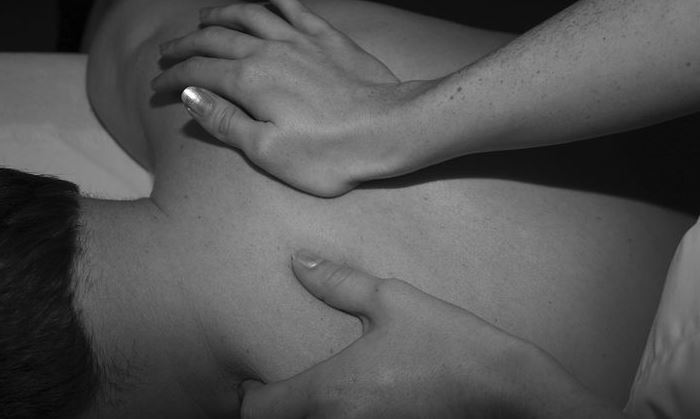 man enjoying back massage